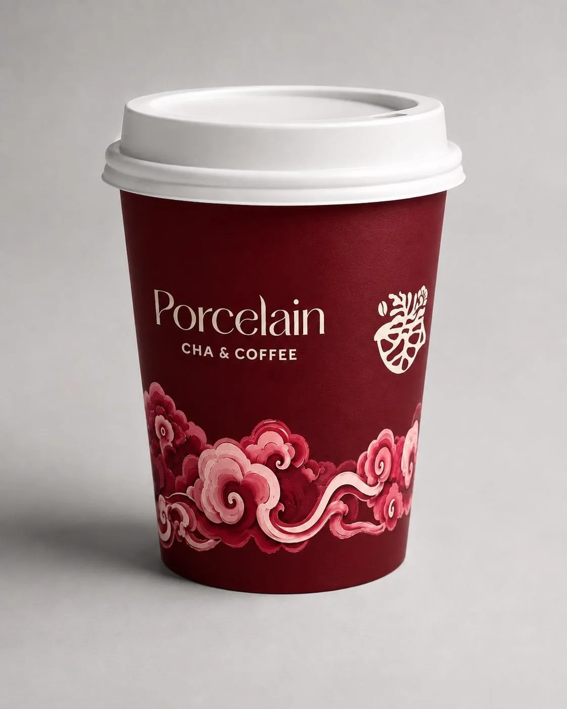 A Porcelain cup in antique red glaze with peony clouds